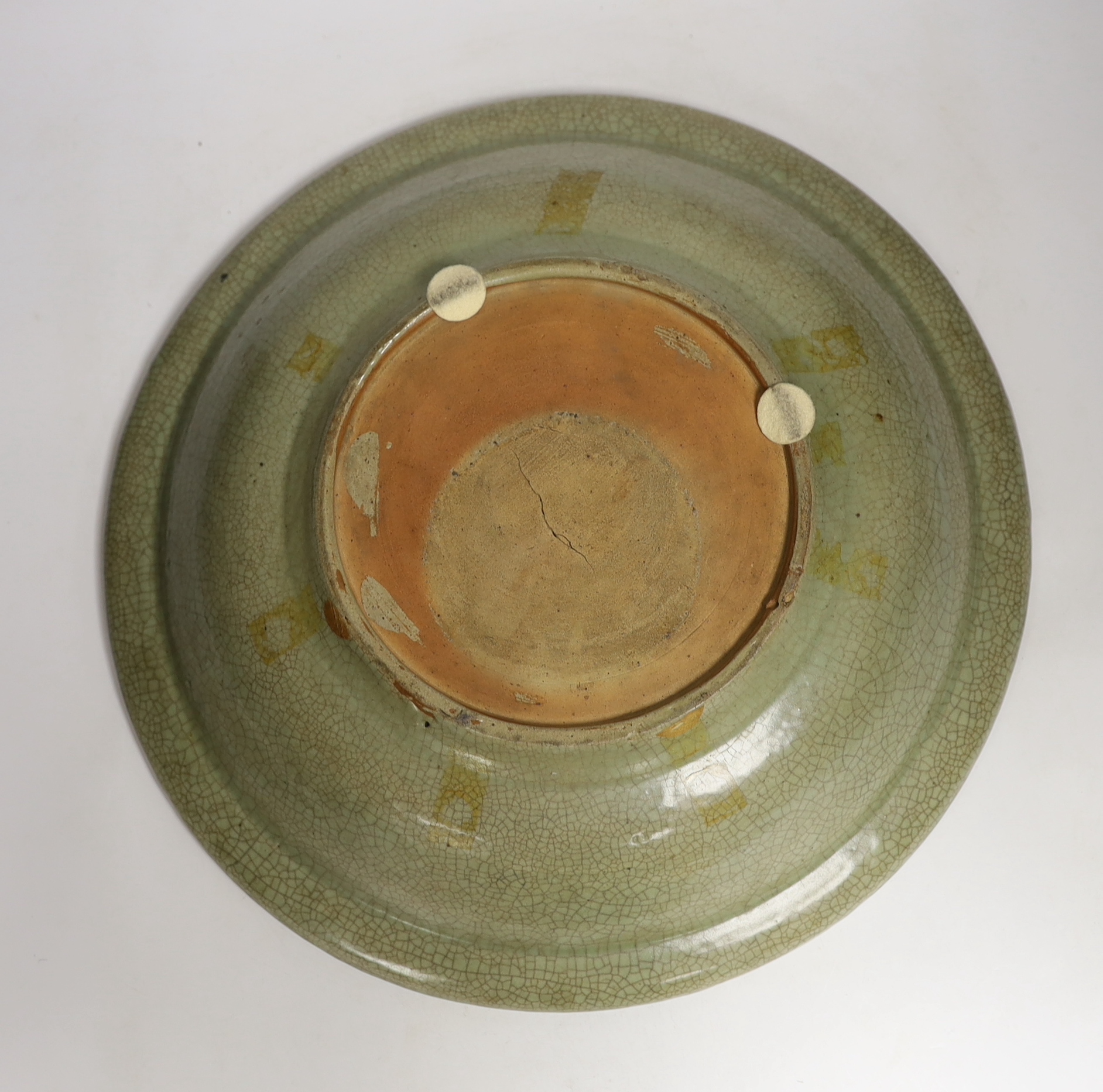 A Chinese Ming Longquan celadon dish, 15th/16th century, 43.5cm diameter